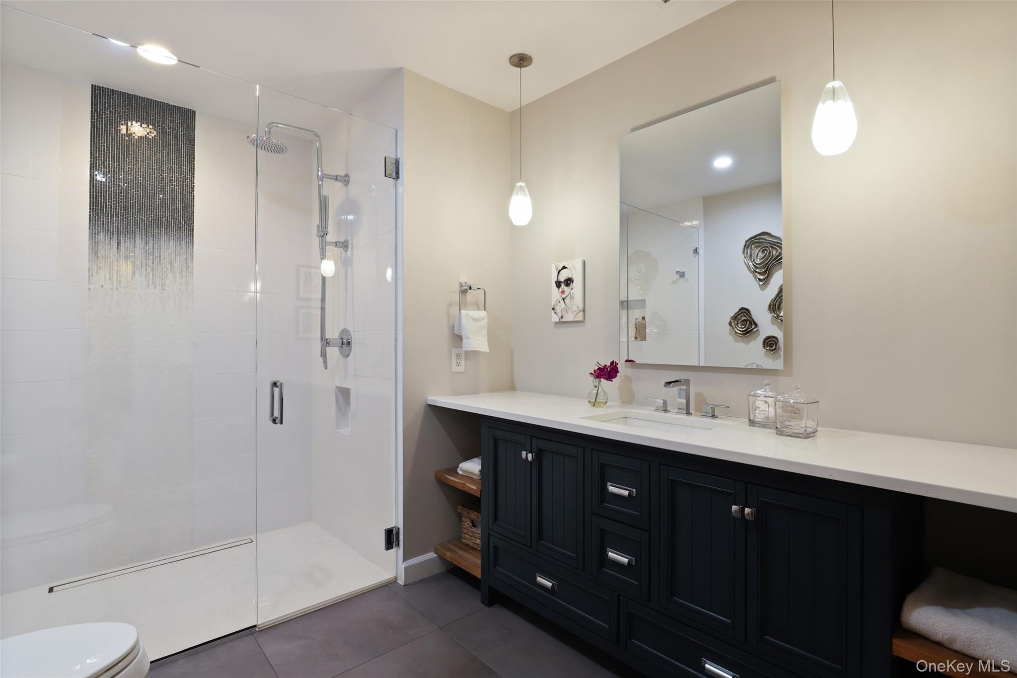 54 Lincoln Avenue Rye Brook, NY 10577 - Photo 29 of 38 a spacious bathroom with a double vanity sink mirror double shower and a bathtub