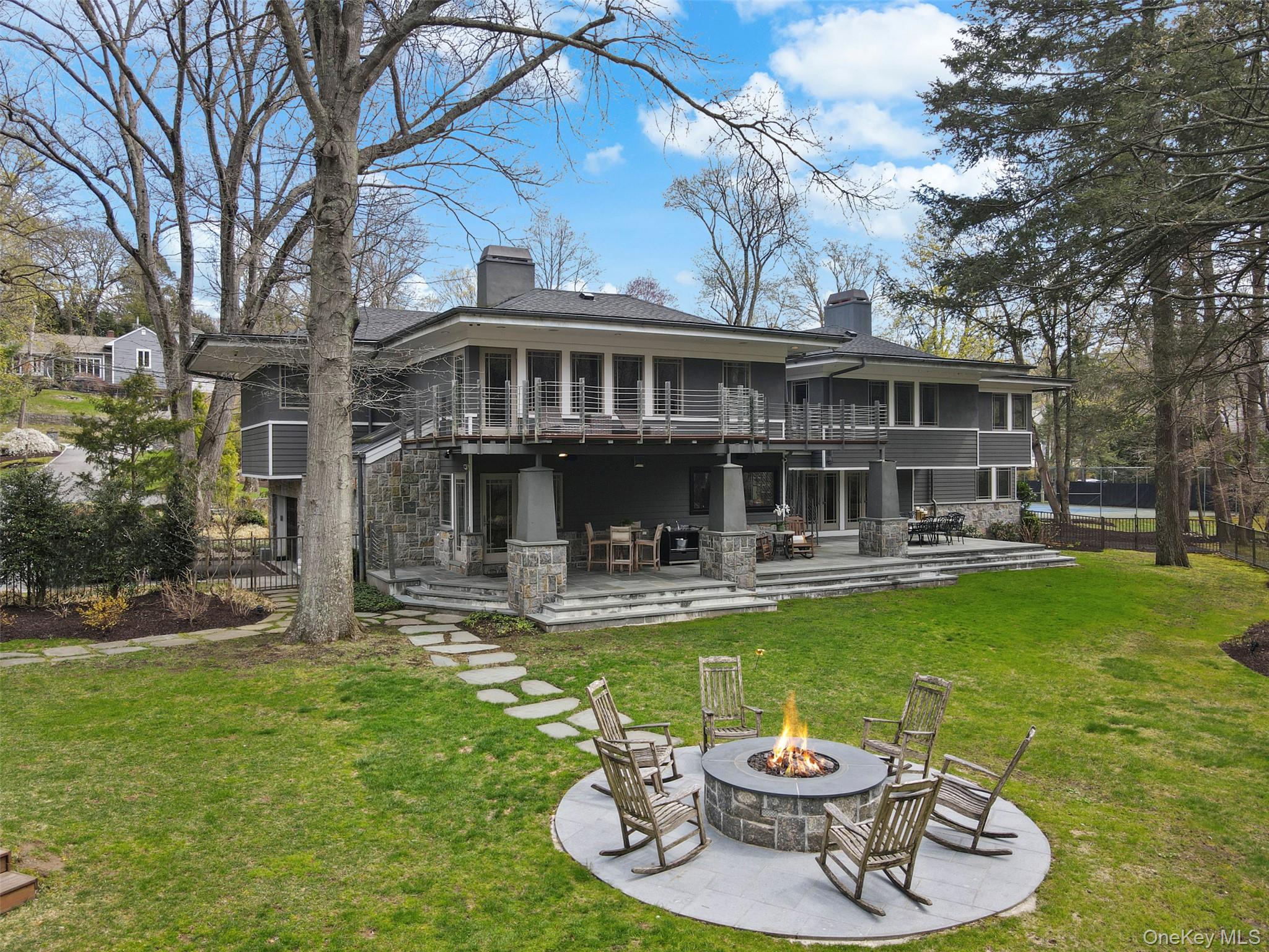 54 Lincoln Avenue Rye Brook, NY 10577 - Photo 35 of 38 a view of a swimming pool with a table and chairs