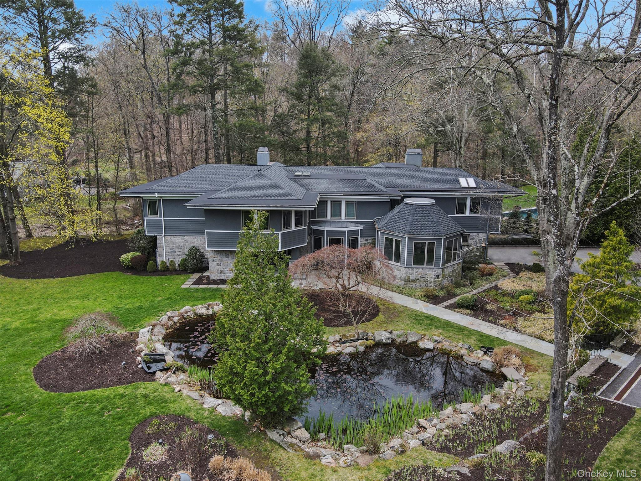54 Lincoln Avenue Rye Brook, NY 10577 - Photo 4 of 38 a front view of a house with a yard