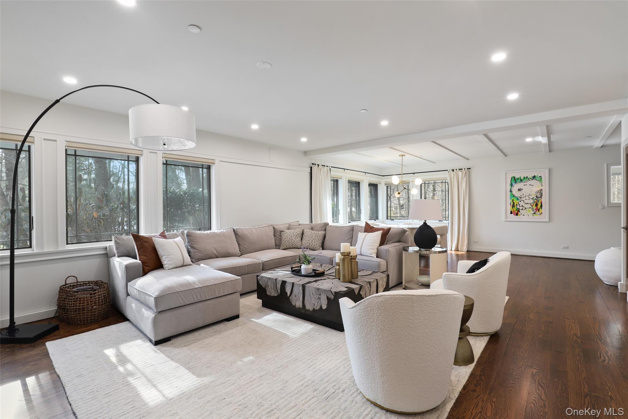 54 Lincoln Avenue Rye Brook, NY 10577 - Photo 10 of 38 a living room with furniture a large window and wooden floor