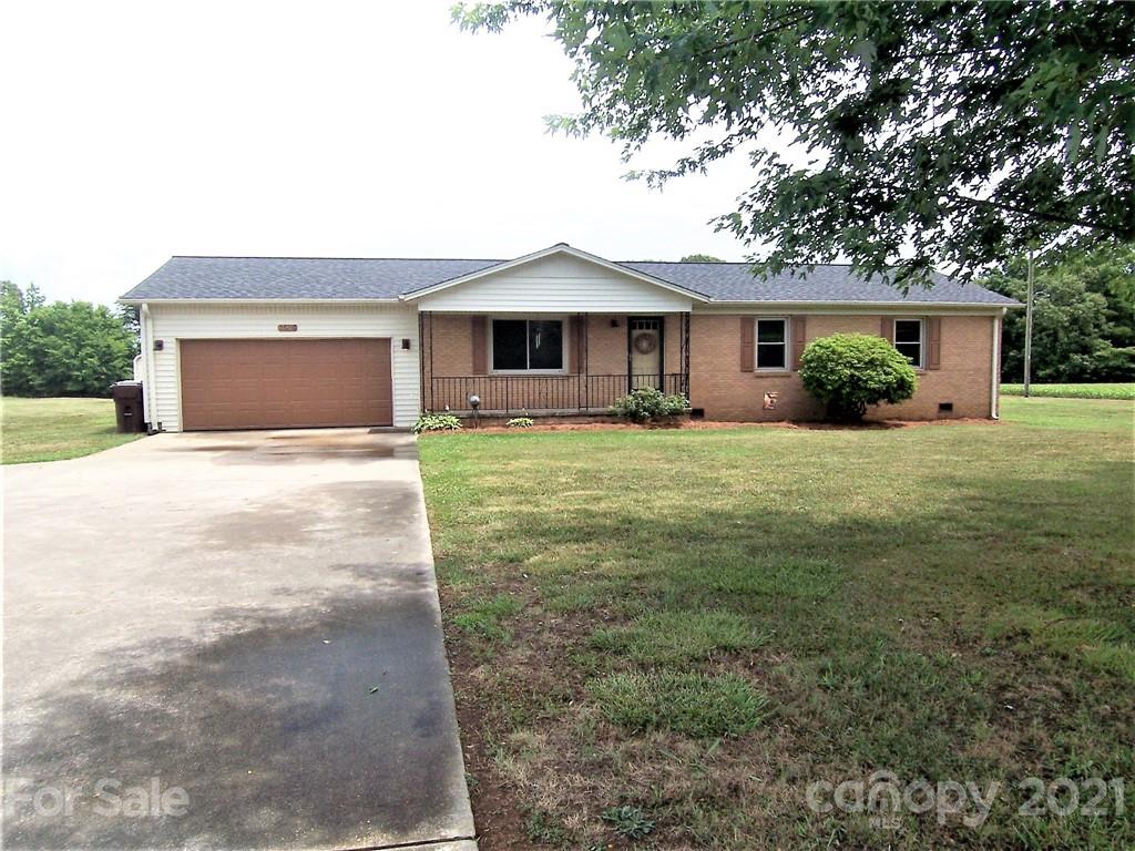 3536 Fallston Road Shelby, NC 28150 - Photo 2 of 34 a front view of a house with yard and garage