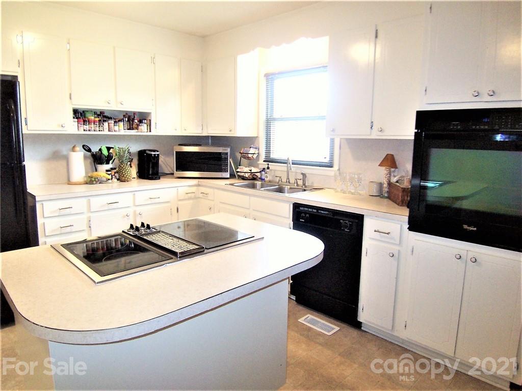 3536 Fallston Road Shelby, NC 28150 - Photo 15 of 34 a kitchen with a sink a stove and cabinets