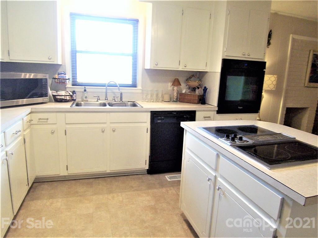 3536 Fallston Road Shelby, NC 28150 - Photo 18 of 34 a kitchen with a stove sink and cabinets