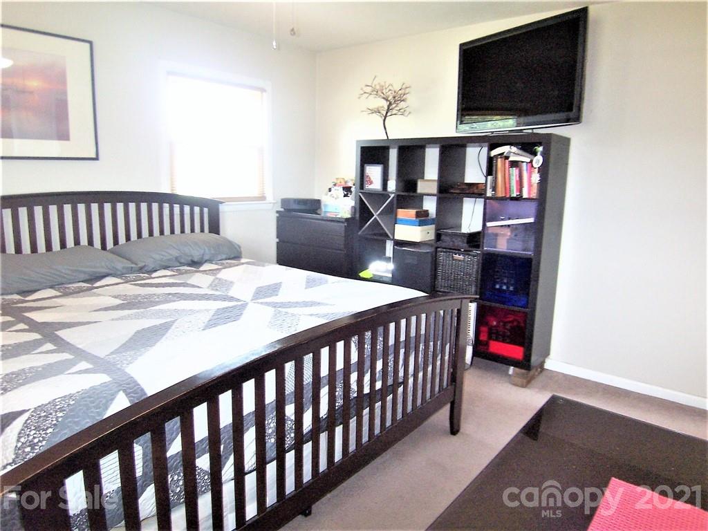 3536 Fallston Road Shelby, NC 28150 - Photo 20 of 34 a bedroom with a bed and a flat screen tv