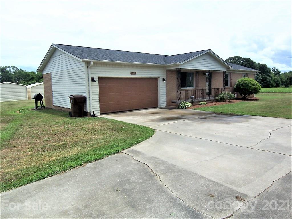 3536 Fallston Road Shelby, NC 28150 - Photo 3 of 34 a front view of a house with a yard and garage