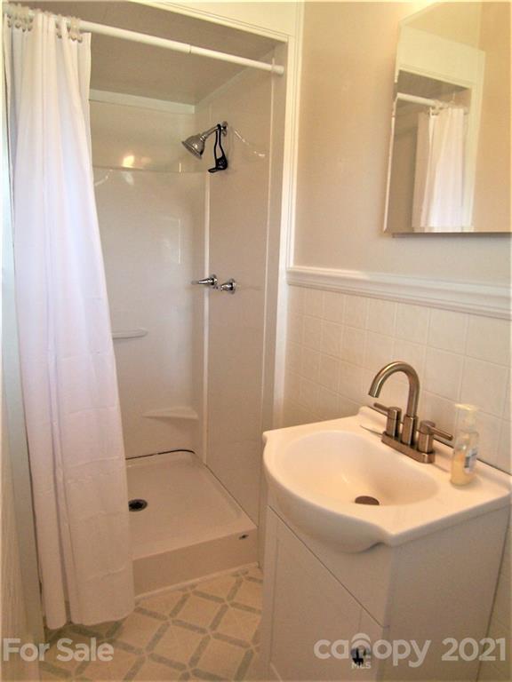 3536 Fallston Road Shelby, NC 28150 - Photo 22 of 34 a bathroom with a sink and a shower