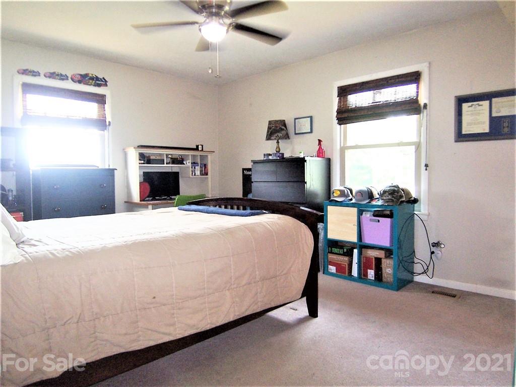 3536 Fallston Road Shelby, NC 28150 - Photo 24 of 34 a bed sitting in a bedroom with a tv