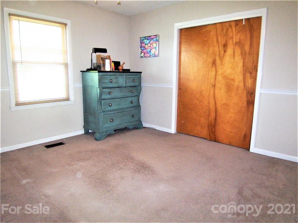 3536 Fallston Road Shelby, NC 28150 - Photo 26 of 34 a view of a bedroom with closet and cabinet