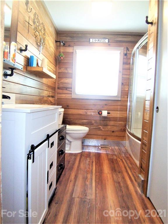 3536 Fallston Road Shelby, NC 28150 - Photo 28 of 34 a bathroom with a sink a mirror and a shower