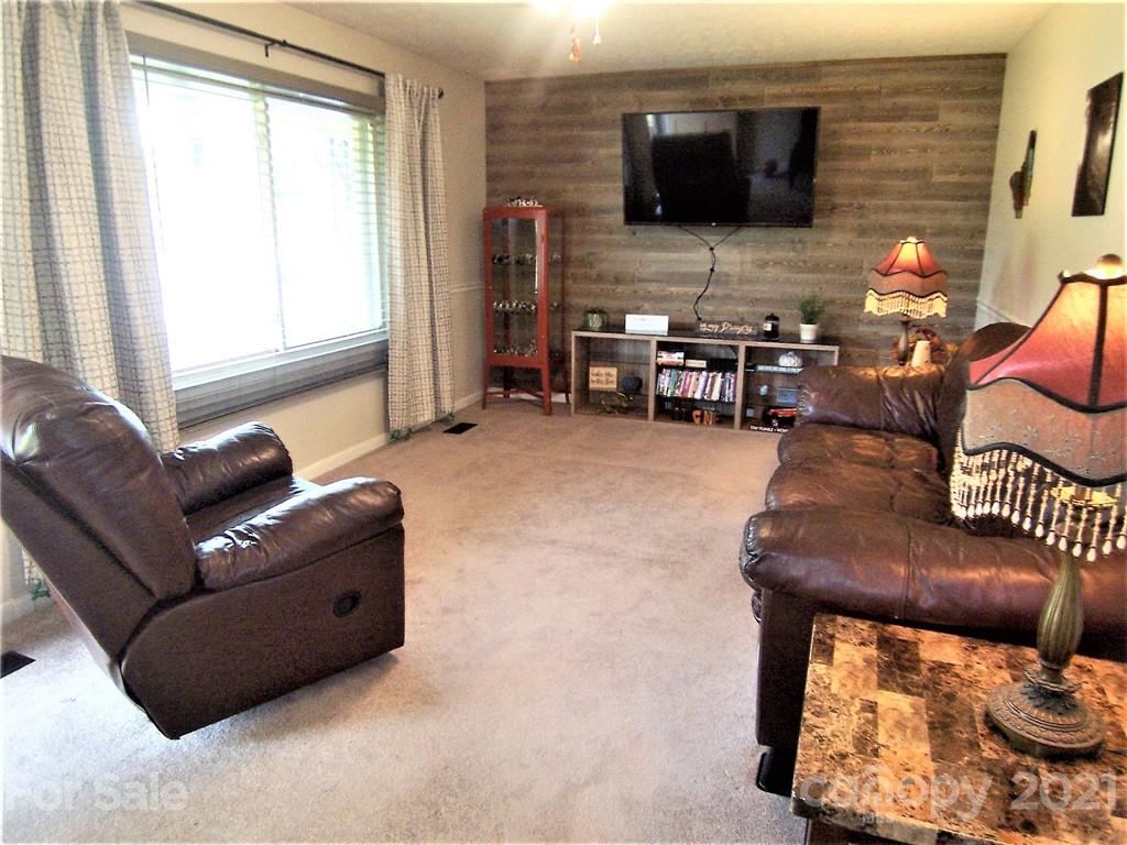 3536 Fallston Road Shelby, NC 28150 - Photo 8 of 34 a living room with furniture and a flat screen tv