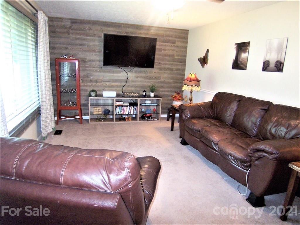 3536 Fallston Road Shelby, NC 28150 - Photo 9 of 34 a living room with furniture and a flat screen tv