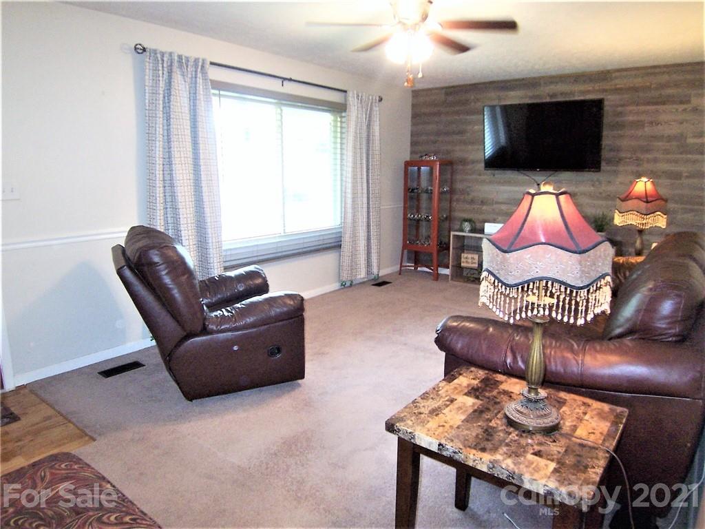 3536 Fallston Road Shelby, NC 28150 - Photo 10 of 34 a living room with furniture and a flat screen tv