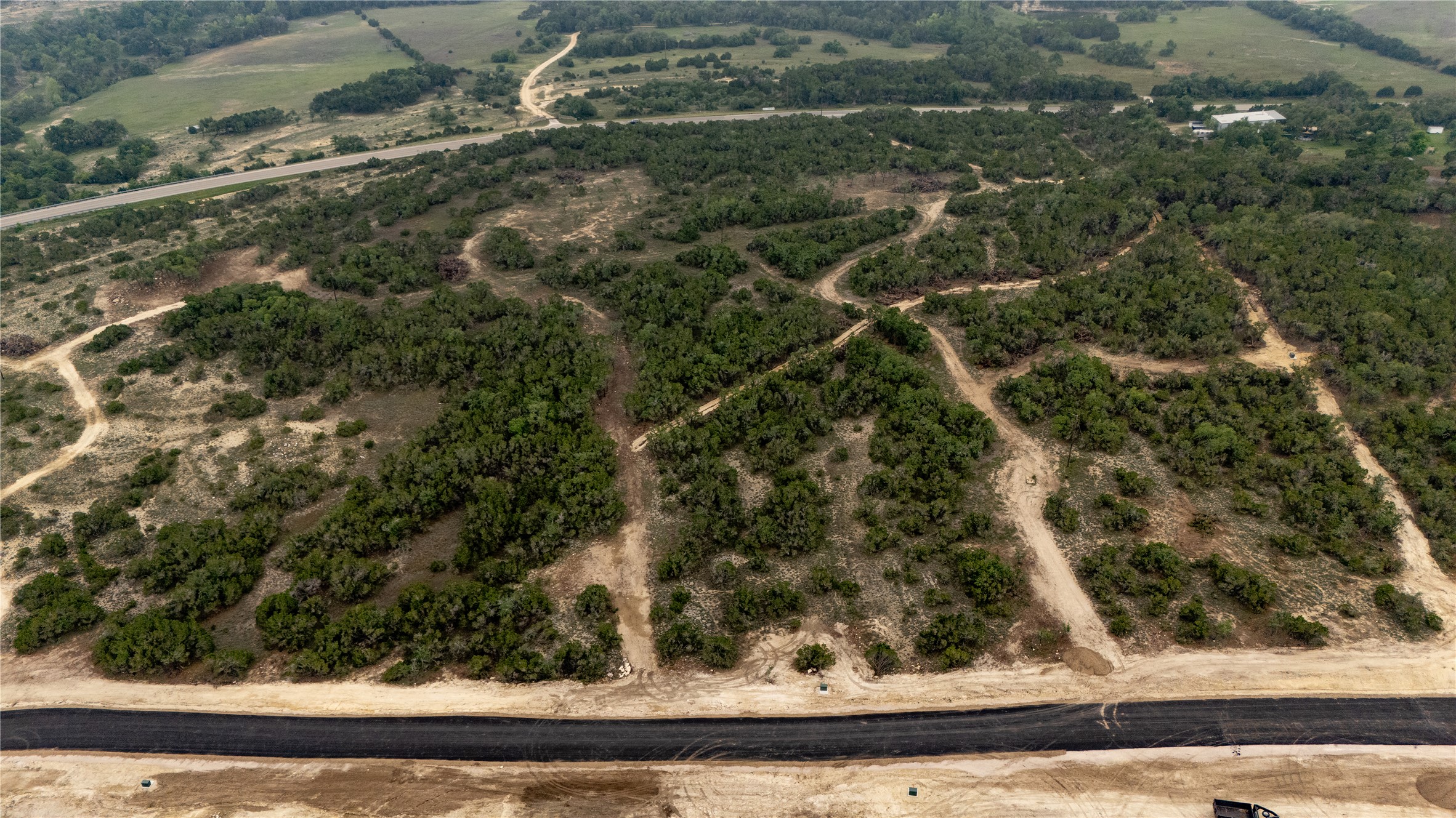 Lot 5 Ranch Road 165 Dripping Springs, TX 78620 - Photo 3 of 12 Expansive undeveloped land featuring a mix of mature trees and open clearings