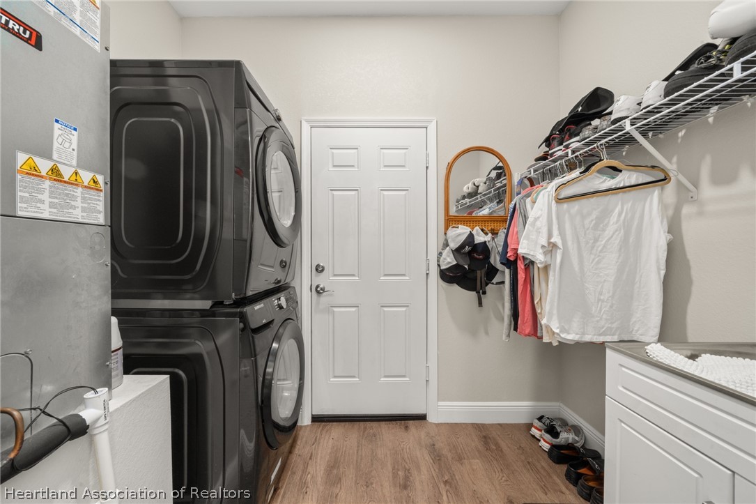 4734 Haw Branch Road, Unit 110 Sebring, FL 33875 - Photo 49 of 50 a view of walk in closet with clothes and shoes