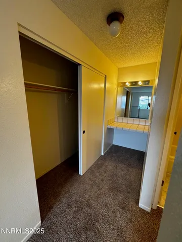 a bathroom with a double vanity sink toilet and shower
