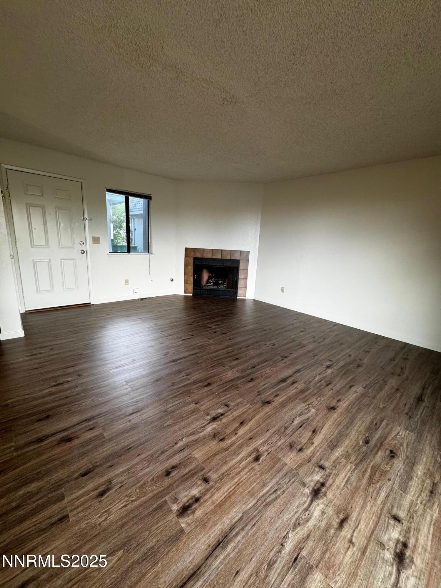 3967 Kings Row Reno, NV 89503 - Photo 2 of 21 a view of empty room with wooden floor
