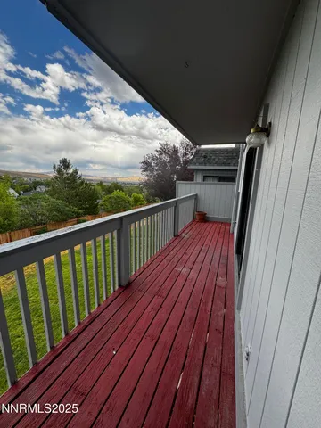 a view of deck with wooden floor and fence