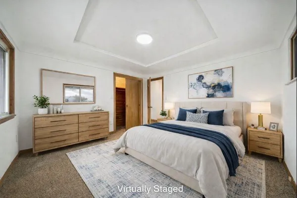 a bed room with a bed and a window