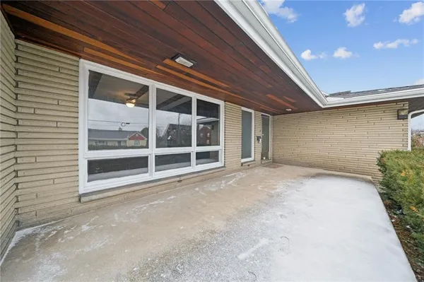 a view of an empty room with a garage
