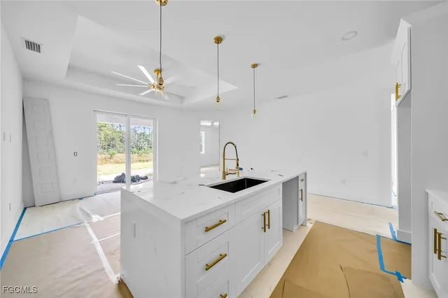 a kitchen with a sink and a window
