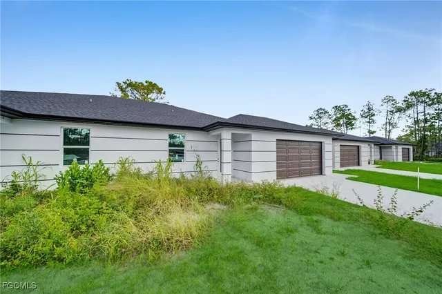 a backyard of a house with lots of green space