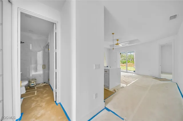 a view of a bathroom with a tub and shower