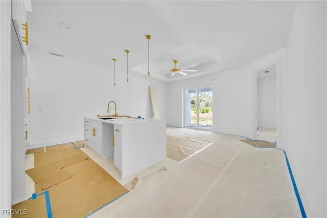 a view of a kitchen with furniture and window