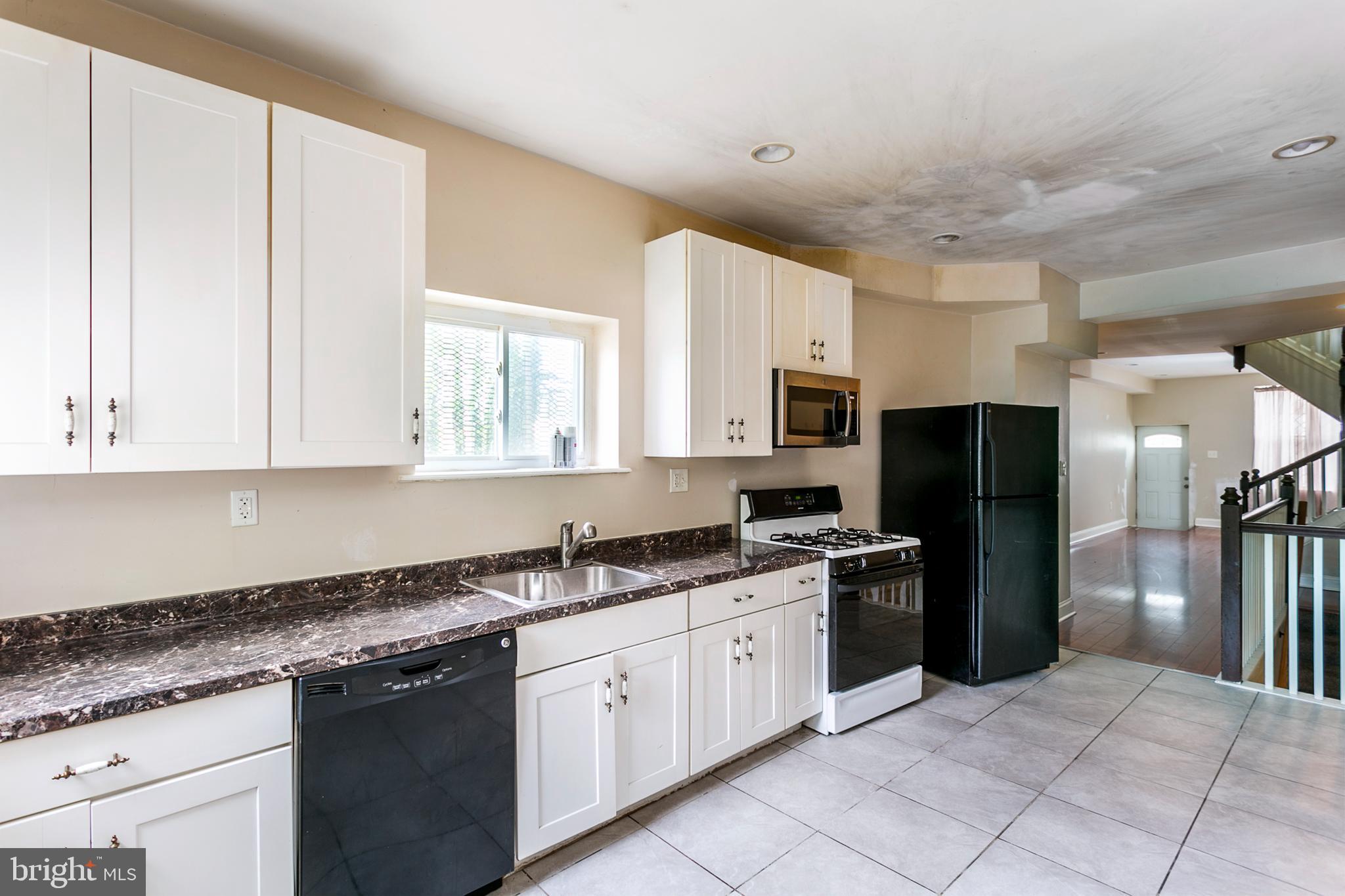 2706 Greenmount Avenue Baltimore, MD 21218 - Photo 8 of 22 Ample counter space, plenty of cabinet storage