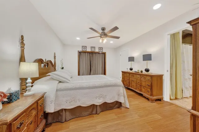 a bed room with furniture and wooden floor