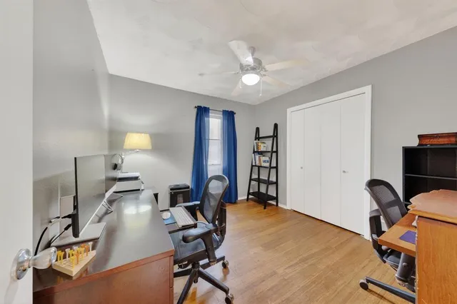 a view of a workspace with furniture and a workspace