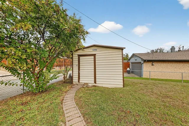a view of a backyard of the house
