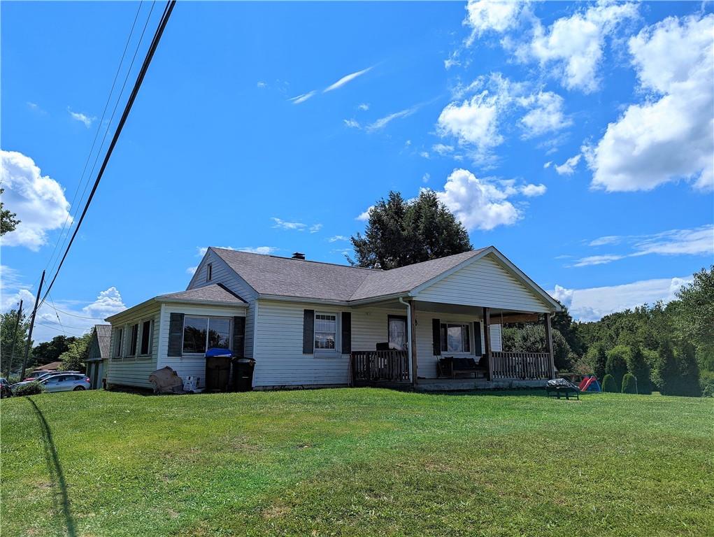 1112 New Castle Road Prospect, PA 16052 - Photo 1 of 25 a front view of a house with a garden