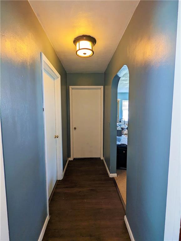 1112 New Castle Road Prospect, PA 16052 - Photo 4 of 25 a view of a hallway with wooden floor and a living room