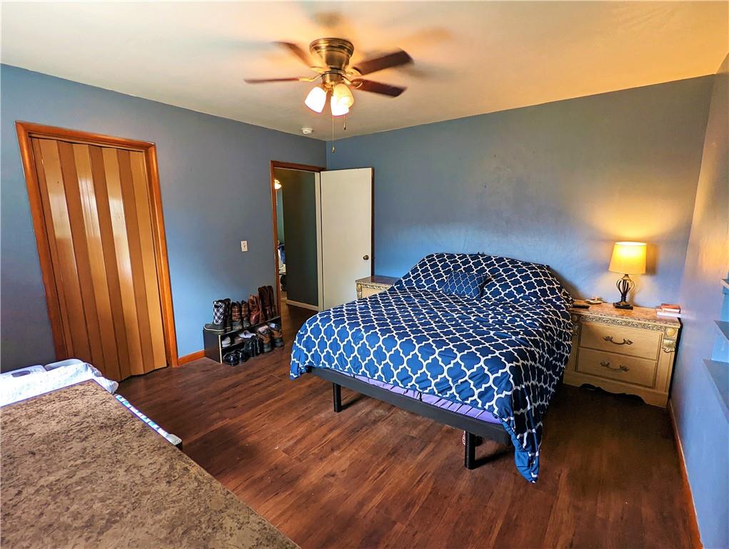 1112 New Castle Road Prospect, PA 16052 - Photo 6 of 25 a bedroom with a bed and a chandelier