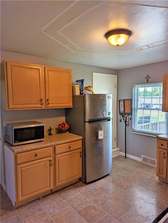 1112 New Castle Road Prospect, PA 16052 - Photo 10 of 25 a kitchen with appliances a sink and cabinets