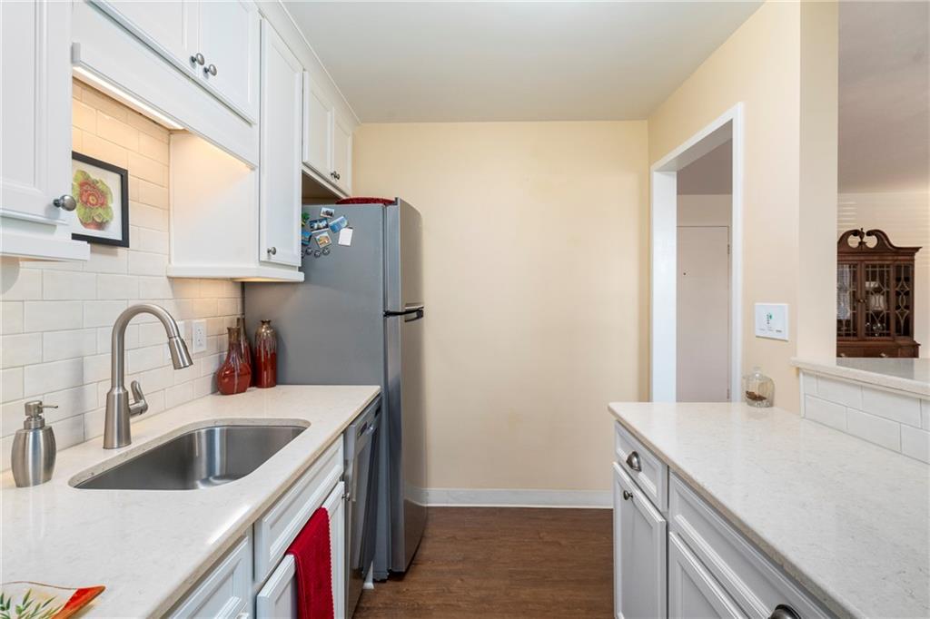 415 Bigham Street, Unit 23 Pittsburgh, PA 15211 - Photo 11 of 24 a kitchen with a sink and a refrigerator
