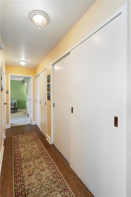 415 Bigham Street, Unit 23 Pittsburgh, PA 15211 - Photo 13 of 24 a view of a hallway with wooden floor and a bathroom
