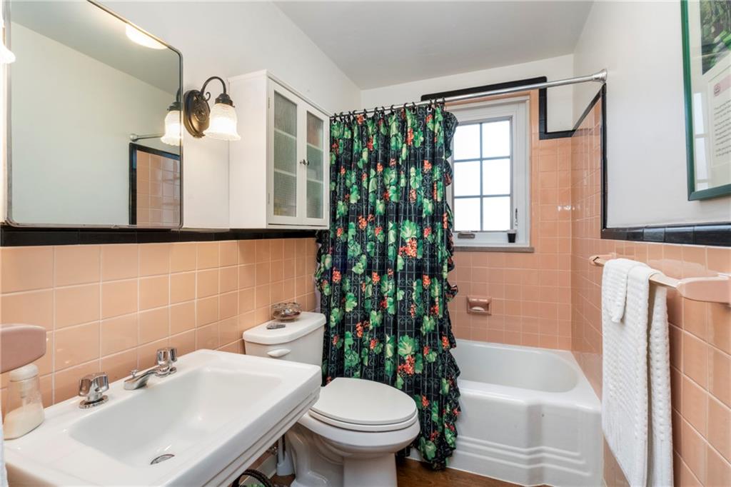 415 Bigham Street, Unit 23 Pittsburgh, PA 15211 - Photo 14 of 24 a bathroom with a sink toilet and shower
