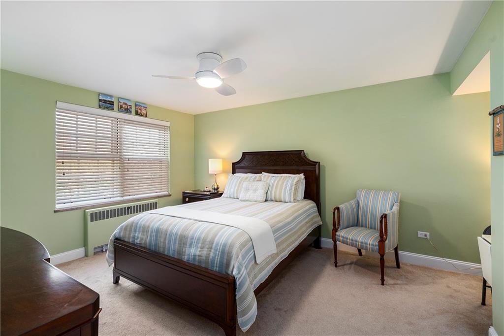 415 Bigham Street, Unit 23 Pittsburgh, PA 15211 - Photo 15 of 24 a bedroom with a bed chair and window