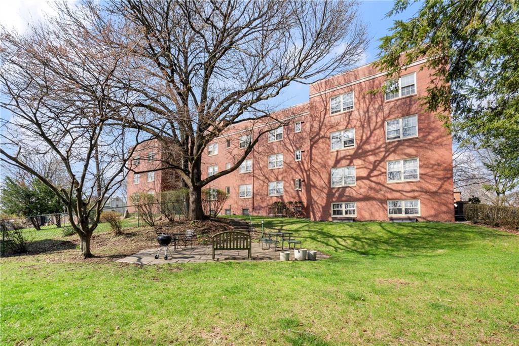 415 Bigham Street, Unit 23 Pittsburgh, PA 15211 - Photo 21 of 24 a backyard of a house with lots of green space