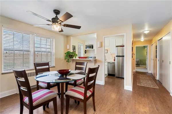 a dining room with furniture and window