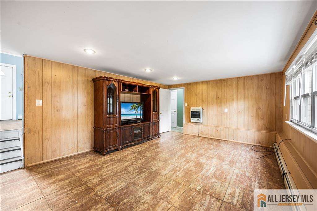 67 Drake Place Colonia, NJ 07067 - Photo 19 of 31 a view of a room with a flat screen tv and front door