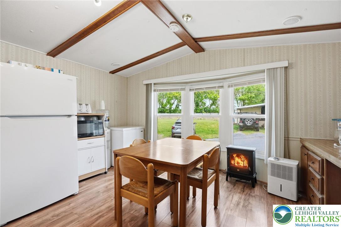 3101 Newburg Road Nazareth, PA 18064 - Photo 8 of 23 a kitchen with a table chairs refrigerator and microwave