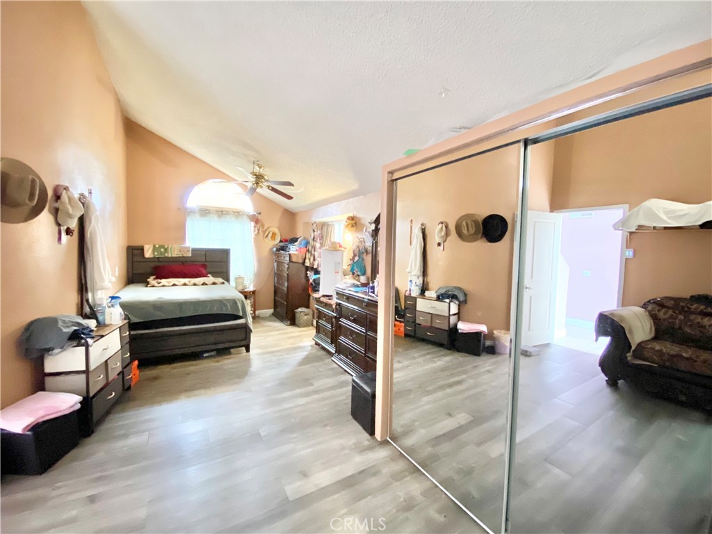 1444 North Sage Avenue Rialto, CA 92376 - Photo 10 of 22 a bedroom with furniture and a large window