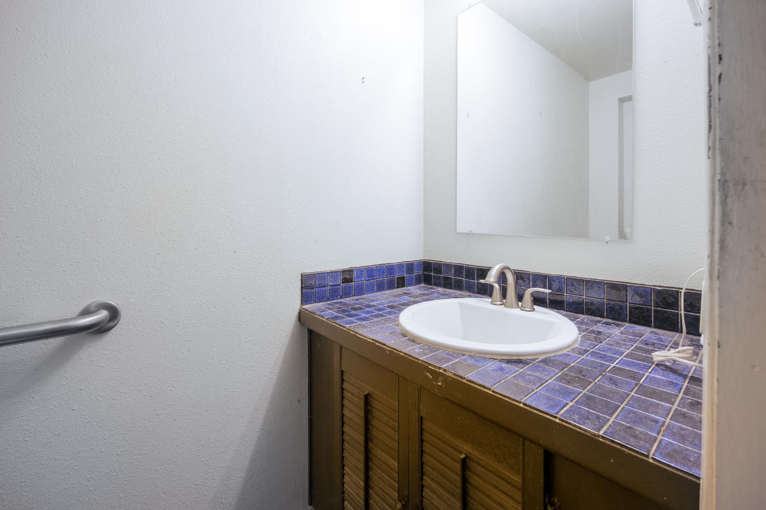 2070 King Of The Mountain Road Pollock Pines, CA 95726 - Photo 17 of 53 a bathroom with a sink and a mirror