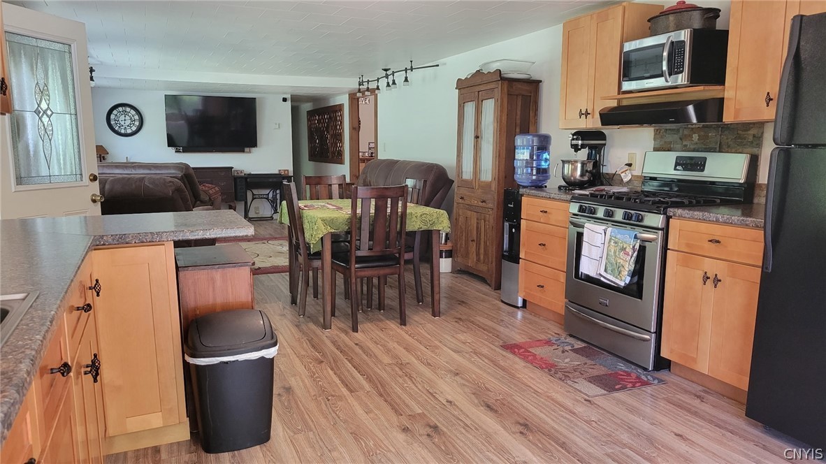 4524 Maybury Road Solon, NY 13101 - Photo 5 of 42 Open kitchen/dining/living room