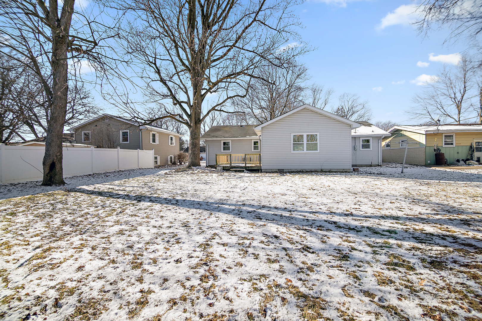 208 Sycamore Lane Momence, IL 60954 - Photo 19 of 19 a front view of a house with a yard covered in snow