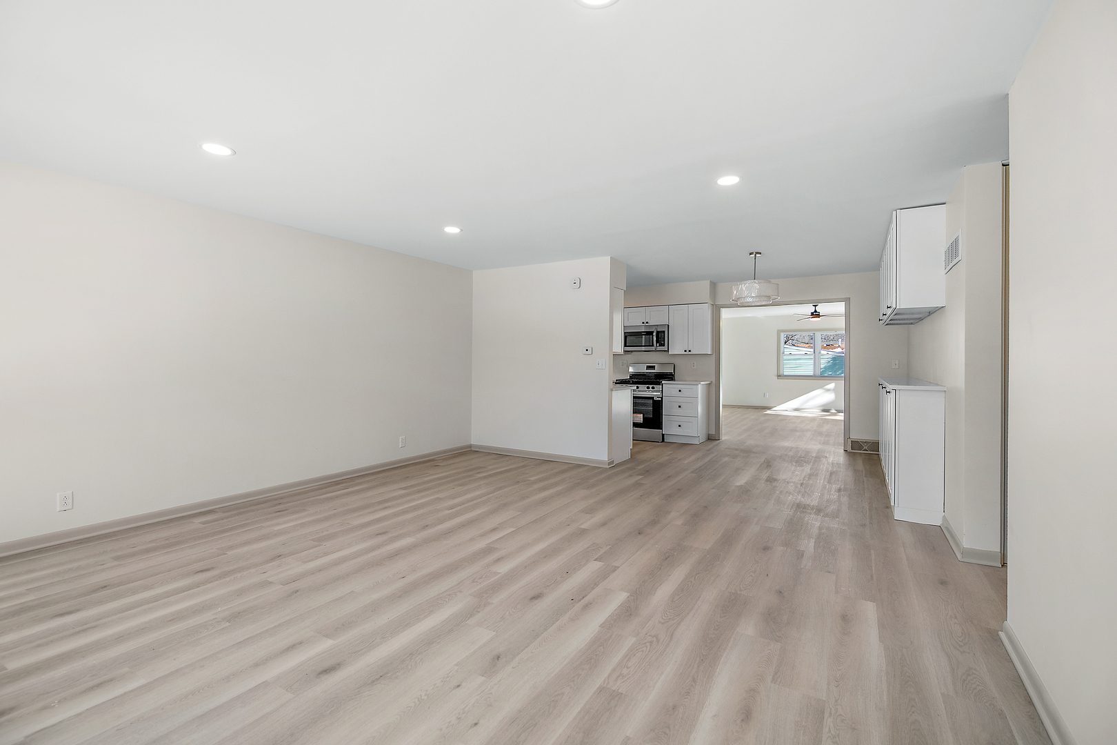 208 Sycamore Lane Momence, IL 60954 - Photo 3 of 19 a view of a kitchen with a sink and a refrigerator