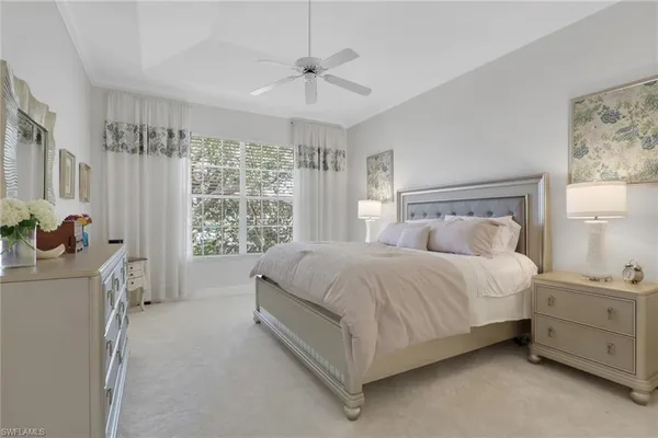 a bed room with a bed and a window