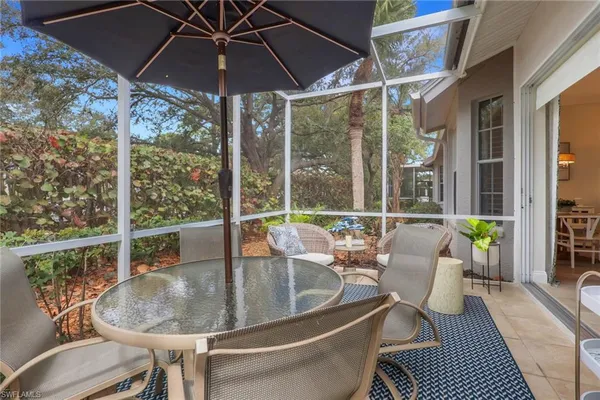 a dining room with furniture and outdoor view